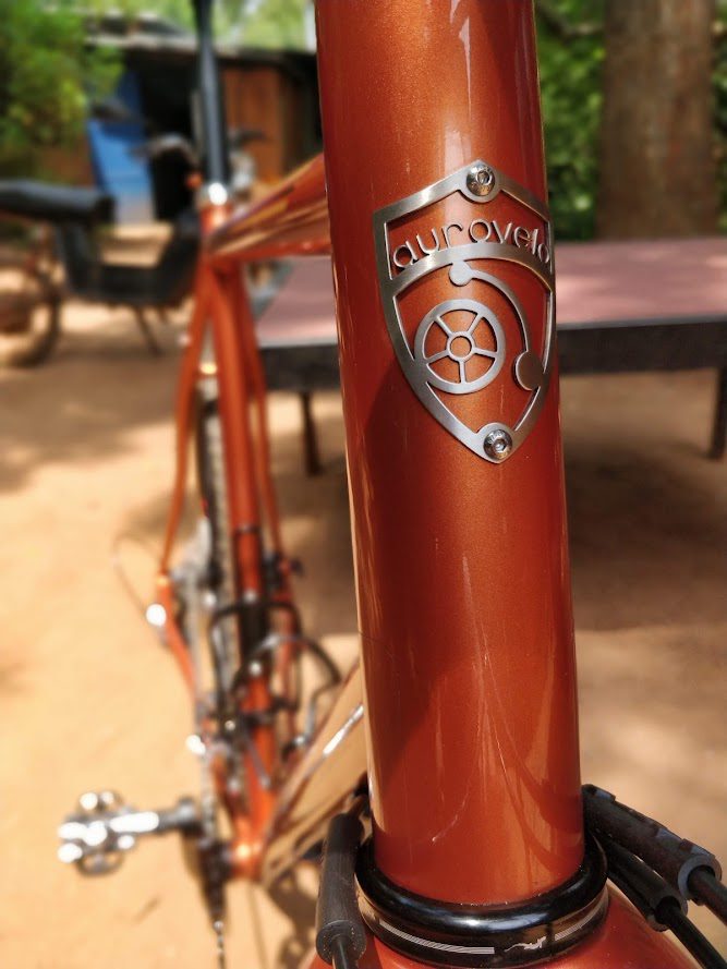 emblem on orange cycle